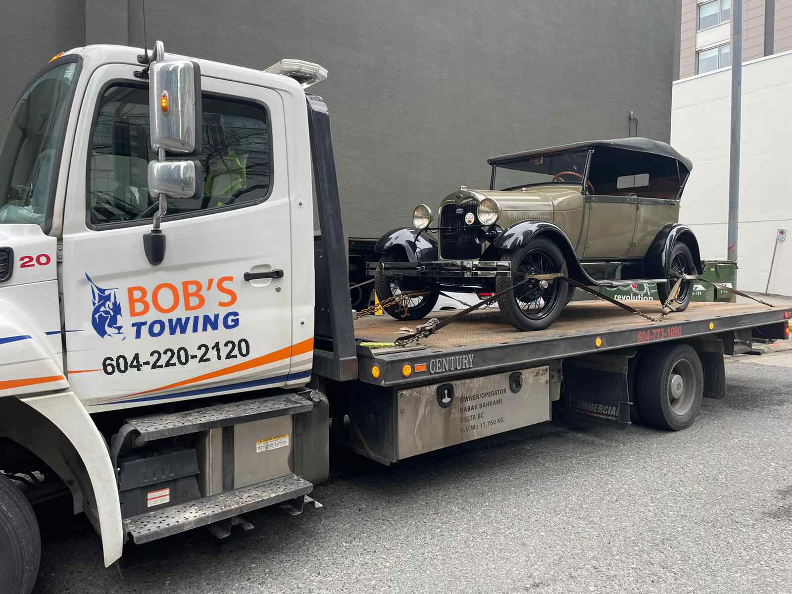 our tow truck is towing a car for towing services burnaby